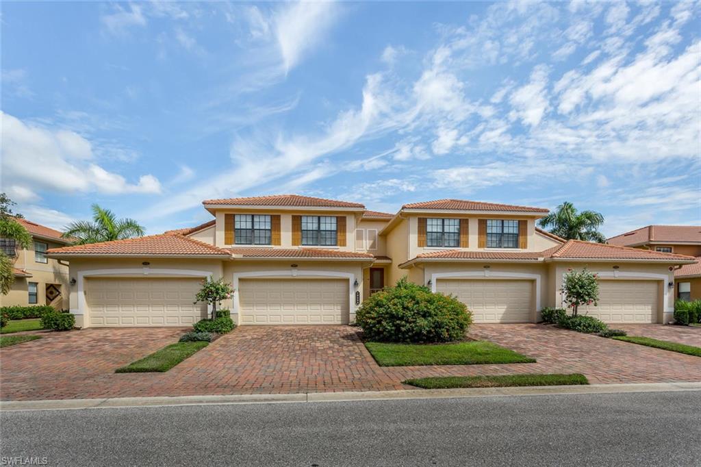 This recently updates 3 bedroom /2 bath second floor coach home has a truly fantastic water view and a beautiful modern new look. The scenic Bolder Lake is one of the largest in Collier County with wide lake views and a long sunset view from the lanai over the lake and the HB bridge. The spacious Oleander offers a two bedroom/full bath guest wing, laundry room with wall cabinets, lots of storage, over-sized bedrooms, 2 car + bonus area garage with a utility sink, 2 huge walk in closets in the master and under the stair, and a large lanai overlooking the lake. All the comforts of home without the worries. Beautifully decorated and some of the furniture is available. Upgrades include tile on the lanai (grout sealed), custom valances on all windows and sliders, fans, custom lighting & chandeliers, LED lighting and pull-out garbage & recycle containers and 2 pull-out shelves in the kitchen. This is one of the last coach homes built in the community in 2011. The A/C has been upgraded with an outside surge protector, a biocide system (UV lights), and a high torque converter.