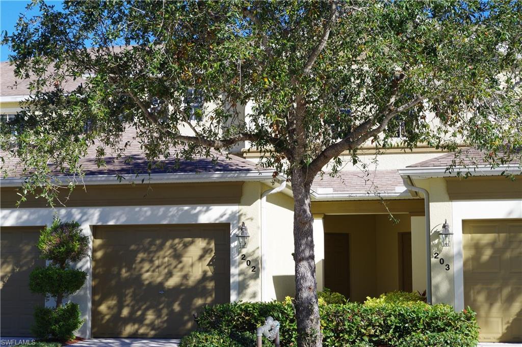 It's time to get out of the cold and into your own piece of paradise at a fantastic price!  This impeccably maintained 2nd floor Coach Home with soaring ceilings and wide, screened lanai is ready for you to make your own.  The Master en suite features a soaking tub and separate shower, huge walk-in closet, and private commode.  There's a Guest Bedroom and Full Bath plus a Den for extra guests or office space.  Very open floorplan with tile on the diagonal throughout the main living area.  New Stainless Steel appliances, newer A/C unit, new bedroom carpet, and freshly painted; the surround sound speaker system is also included. Excellent location close to Sanibel and Ft Myers Beach, about 20 minutes to RSW Intl. Airport, close to medical facilities, shopping, restaurants, golf, you name it!  Calusa Palms is a gated neighborhood with heated Community Pool, Exercise Room, Play Area, Tennis Courts, Bocce, and Pickleball.  This unit has a 1 car garage and Foyer with storage - plenty of room for golf clubs, bicycles, beach gear, etc!  Lawn maintenance, cable, internet and amenities included.  Compare the size of the unit, location and amenities and you won't find a better value!