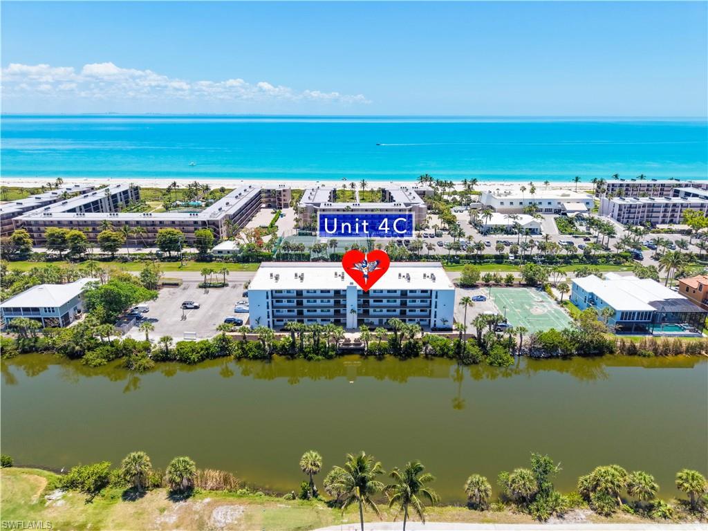 Situated in the desirable Sandpebble complex on Sanibel Island, this beautiful 2-bedroom, 2-bath condo offers an ideal blend of comfort, convenience, and coastal charm. The living area features an open floor plan with stunning riverfront and canal views. Conveniently located on the canal and just across from the beach, this unit provides a true beachy vibe both inside and out.

Recently updated, the condo boasts new vinyl flooring throughout, modern kitchen cabinets, and updated bathrooms. The community includes an elevator for easy access and a coin-operated laundry room. Enjoy relaxation and comfort in the heated pool, set in a private area with newly planted vegetation—a perfect way to soak up Sanibel's beautiful sunshine! This property is meticulously maintained,  Enjoy the convenience of being directly on the bike path leading to over twenty miles of riding enjoyment.