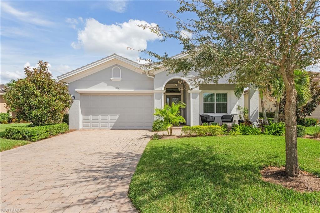 This is truly a wonderful move-in ready home and a pleasure to show with fine craftmanship and impressive details throughout. Upon entering, take in the expansive lake to golf views from every angle and imagine the fun of entertaining your friends or just relaxing on the spacious screened lanai.  The popular LARGO floor plan with 2 bedrooms PLUS DEN is light, bright & open offering unique touches like trey ceilings & crown moldings, diagonal tiles throughout, large kitchen w/ plenty of cabinet space & Cambria counters, S/S appliances, NATURAL gas cooktop, large prep island, walk-in pantry, breakfast bar,  plantation shutters throughout, triple sliders to the paver lanai, STORM SMART electric hurricane screens on lanai, electric shades in great room, checkerboard flooring in garage, custom cubby in laundry, large owner's suite w/ lanai access, spacious walk-in closet, a wonderful main bath with walk-in shower w/glass tile detail, dual sinks/vanities.  Large backyard w/room for a pool. Verandah offers an active lifestyle w/ 2 championship golf courses, practice range, lighted tennis courts, bocce courts, fitness center, pool, walking trails, kayaks, dog park, clubhouse & restaurant.