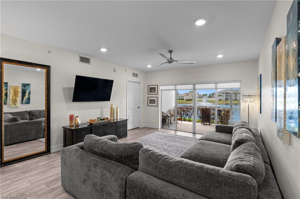 Wake up to shimmering lake views and the gentle sound of a fountain just outside your door. This beautifully renovated 2-bedroom, 2-bathroom ground-floor condo in the gated Blue Heron community offers the kind of effortless Naples lifestyle that is increasingly hard to find at this price point.
From the moment you step inside, the thoughtful upgrades are impossible to miss. Rich new flooring flows throughout — not a single inch of carpet — complemented by fresh paint, designer high-hat lighting in the living, dining, and bedroom areas, and an open floor plan crowned by soaring high ceilings. The kitchen features updated countertops, and both bathrooms have been fully refreshed with new flooring and vanities. A custom built-in closet system in the primary suite adds a boutique hotel touch that everyday living rarely delivers.
The broad lake and fountain views are yours from the comfort of your ground-floor lanai — no elevator, no stairs, just step outside and exhale. The community itself is equally impressive, with a resort-style clubhouse and pool perched directly on the lake, making every day feel like a retreat.
All appliances are three years old or newer, meaning this home is truly move-in ready from day one. Covered parking and abundant guest parking round out the practical conveniences.
And the location? Blue Heron places you within easy reach of the world-class dining, boutique shopping, white sand beaches, and vibrant energy of downtown Naples — the best of Southwest Florida, right at your fingertips. Home includes a One Year Warranty and Professional Cleaning at Closing.