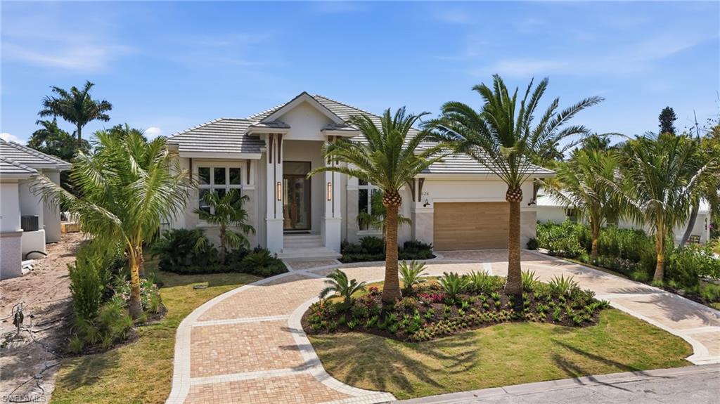 Experience modern luxury in this brand-new Park Shore home, expertly crafted by Borelli Construction. Spanning over 4,600 square feet on a single level, this exceptional residence sits on an oversized, southern-facing lot and features five spacious en-suite bedrooms, along with an expansive lanai and resort-style pool deck. Offered fully furnished and professionally styled by Clive Daniel Home, the interior showcases custom wall treatments, designer finishes, and meticulously curated details throughout. The chef’s kitchen is complemented by a true butler’s pantry equipped with additional appliances, while the stunning great room features a dramatic ceiling and a striking raked plaster wall unit. Premium features include Wolf and Sub-Zero appliances, European white oak flooring, Samsung Frame TVs, Lutron lighting automation integrated with Control4, and a whole-house generator—delivering the ultimate in luxury, comfort, and convenience. Designed for seamless indoor-outdoor living, the lanai is equipped with motorized screens and shutters for both comfort and storm protection. The outdoor space offers a spectacular pool, spa, and expansive deck, complete with a built-in fire pit and extensive use of low-maintenance turf for year-round enjoyment. The primary suite is a private retreat, featuring an oversized spa-like bath with dual water closets, a large multi-function shower, and expansive walk-in closets with floor-to-ceiling custom cabinetry and integrated storage solutions. Located just a short walk from the Park Shore private beach park, this elevated residence is built to meet current FEMA requirements, with both the home and mechanical systems designed for peace of mind.