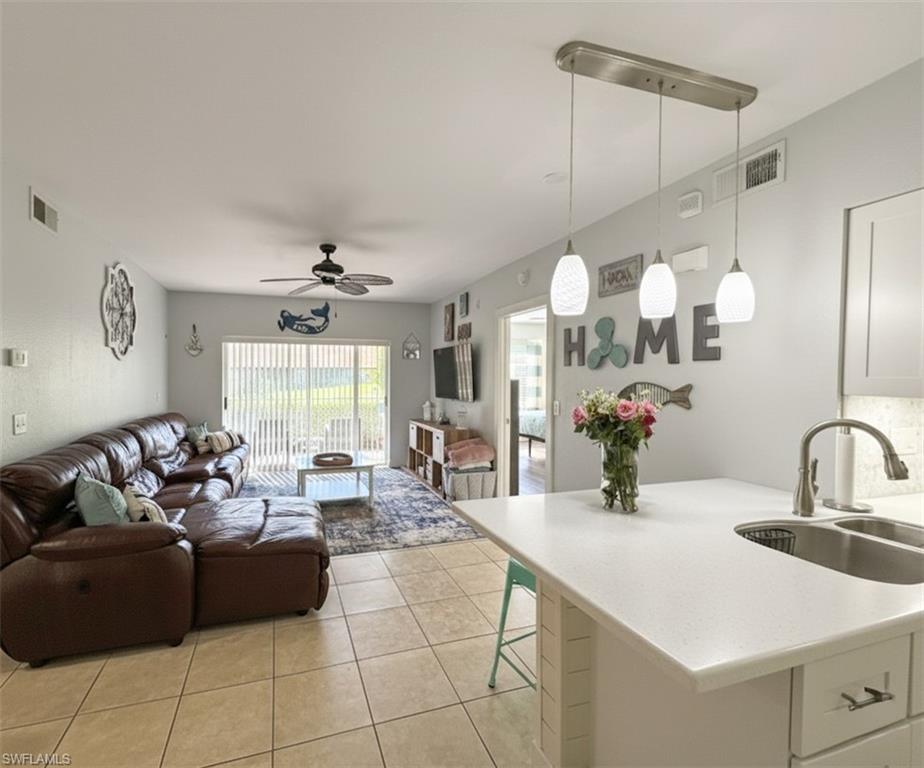 Welcome to this beautifully upgraded 2-bedroom, 2-bathroom first-floor condominium in the heart of Bonita Springs! Featuring a private entrance and surrounded by lush green space, this pet-friendly community offers the perfect blend of comfort and convenience. Ideally located just minutes from the beaches, shopping, dining, and I-75, you'll also enjoy the ability to walk to charming downtown Bonita Springs. Inside, this well-maintained home offers stylish upgrades and easy first-floor living. Residents enjoy a variety of amenities, including a sparkling community pool, clubhouse, and playground. With low HOA fees, two assigned parking spaces (one covered), plus ample guest parking, this property offers exceptional value. Whether you're looking for a year-round residence, seasonal retreat, or investment opportunity, this move-in-ready condo provides the Florida lifestyle you've been dreaming of!