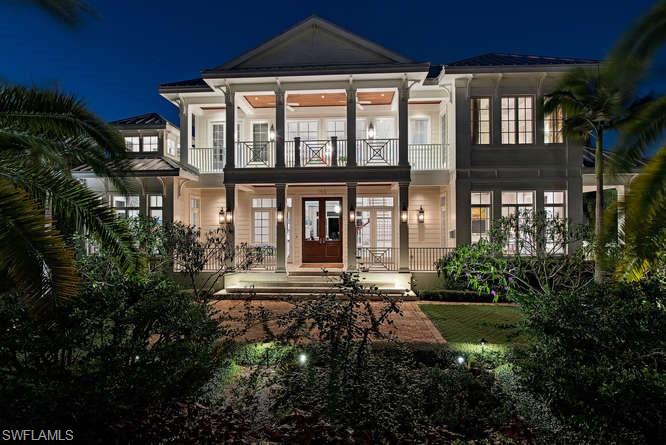 H.15145 - Coastal glamour & classic elegance! Exceptional 2014 smart home. Top line features & fixtures, 4 doors from the Gulf! Wood floors, tons of windows, island influence design in the very heart of Olde Naples near the best restaurants, shops,galleries in SWFL! Designed for gracious entertaining inside & out. Spacious & inviting! Luxurious 1st floor master suite, w/2  huge closets. Elevator to 3 roomy guest suites w/balcony access. Separate 4th VIP guest suite w/kitchenette & balcony; 3 car gar. Enormous chef’s kitchen; trough sink, six burner Wolf gas range, SubZero fridge, Wolf steamer, 2 Bosch dishwashers. Big island & dining table topped w/gorgeous “Mystery White" marble slabs, 'crisp white w/crystalline feathering' Lots of seating & prep space; open to grand family room & formal dining. Lofty vaulted, wood paneled, beamed ceilings, transom windows, walls of white  glass fronted cabinets. Tons of light, most rooms open onto lanai w/pool/spa/full kitchen, 2 story cypress ceiling, cupola, clerestory windows; recessed electric screens. Lush palms, tropical landscaping for privacy. Colorful sunset skies to enjoy while lounging on lanai/pool float. Feels Like a 5 star resort!