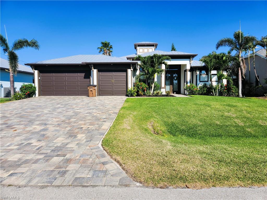 This Cayman Model has been meticulously maintained and is in like new condition. Located in the Highly desirable SW Cape Coral area in a quiet family neighborhood, it features 2200 SQFT, 3 Bedrooms + Den/2 full baths, Metal roof with a cupola, and 3 car garage with an epoxy finish on the floor. 6x36 Wood Plank tile throughout the entire home, wood in the den, crown molding with rope lighting in the tray ceilings, LEVEL 5 granite counter tops, LEVEL 5 drywall finish, and stainless steel appliances! Light Fixtures included! This home will also include the connections for a 15KW generator. Underground Electricity! The salt water pool comes equipped with a full outdoor kitchen and vented hood, picture screen pool enclosure, and  extended lanai. This home is loaded with upgrades.
This home is perfect if you're looking to live a stress free, Florida lifestyle in a neighborhood that's safe and secure for you and your family.