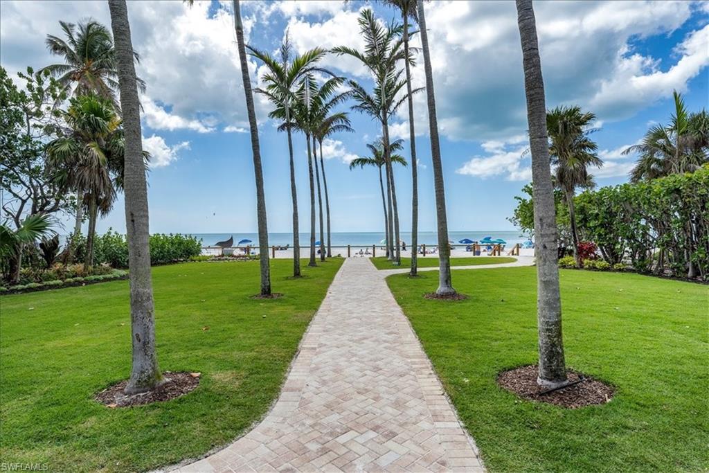 One or more photo(s) has been virtually staged, AI generated or rendered.  Live just steps from the beach in this bright and airy 1-bedroom, 1-bath end unit located in the heart of Old Naples. Surrounded by million-dollar homes and tropical landscaping, this corner condo is filled with natural light from three sides and offers peaceful garden views right from your porch. Inside, you’ll find an updated kitchen and bathroom, along with a brand-new A/C—no upgrades needed, just move in and enjoy. The location can’t be beat: walk to 5th Avenue’s boutique shops, cafes, and theaters; explore 3rd Street’s farmers market and dining scene; and catch concerts or art shows at Cambier Park. And of course, you're only a block from the beach and those iconic Naples sunsets. Available now. Don’t miss your chance to rent in one of Naples’ most coveted locations.