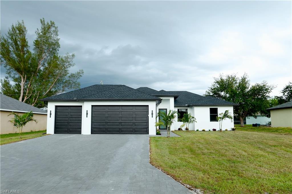 Welcome to this beautifully upgraded 3-bedroom, 2-bath home, featuring modern finishes and thoughtful details throughout. From the moment you arrive, the oversize paver driveway makes a grand first impression. Spacious open floor plan with porcelain tile flooring throughout. Stylish stainless-steel appliances in the kitchen. Impact-resistant windows for comfort and peace of mind. Epoxy-coated garage floors for a clean, durable finish. This home combines elegance, function, and Florida lifestyle charm.