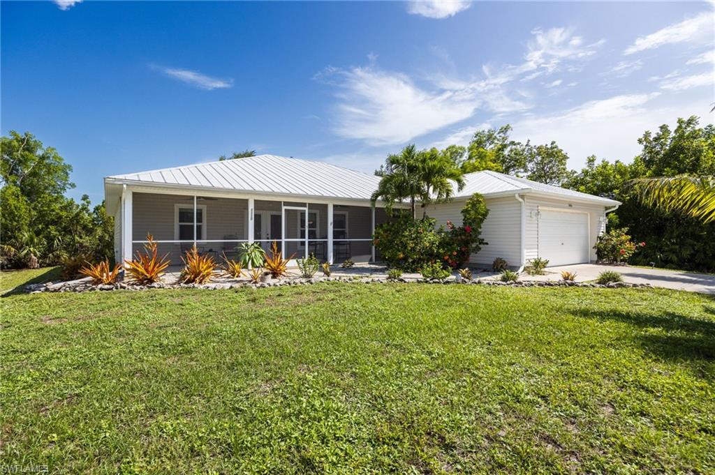 Island Living at an Incredible Value!

Don't miss this opportunity to own an 1802 sf under air/2275 sf total beautiful partially furnished 3-bedroom, 3-bath concrete block one-owner home with a dedicated office and a 2-car garage in the charming community of Pine Island Village in beautiful St. James City, Florida. Priced below market value at just $215.87/sf, this home offers exceptional features and unbeatable value. Best of all this home is NOT in a Flood Zone!! No Flood Insurance required.

Designed with comfort and functionality in mind, the spacious split-bedroom floor plan provides for creative use of the open concept living area with cathedral ceilings, and privacy for family and guests. The master has an en-suite bath, walk-in closet, reach-in closet and slider access to the back lanai. The home features durable tile flooring throughout, with carpet in the bedrooms, a walk-in pantry, convenient washer and dryer hookups, and separate office, all with abundant natural light.

Enjoy Florida's outdoor lifestyle year-round from the two large tiled front and rear screened patios—perfect for morning coffee or evening relaxation. Listen to the birds and watch the palm trees sway as you pass the hours away in your private retreat!

Built for peace of mind, this concrete block home includes impact-resistant windows and doors, a metal roof, and a newly installed whole-house Generac generator, ensuring comfort and security during any season.

Residents of Pine Island Village enjoy access to a refreshing community pool while embracing the laid-back island lifestyle, all just minutes from shopping, dining, and everyday conveniences.

This is your chance to own a move-in-ready island retreat at an exceptional price! Schedule your private showing today and discover the relaxed beauty of island living!