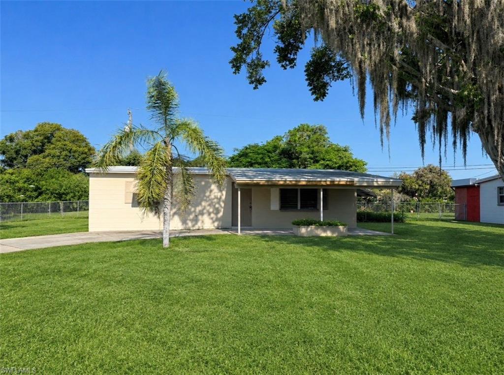 Affordable starter home or investment property, NEW ROOF IN 2026, NEW ELECTRICAL PANEL BOX IN 2020, NEW WATER HEATER IN 2025, central heat and air replaced in 2015, CENTRAL WATER AND SEWER, CONCRETE BLOCK HOME, circular driveway, covered carport,  ceramic tile floors throughout for easy maintenance, in need of some minor cosmetics but priced accordingly, neighborhood atmosphere located within walking distance to stores etc. as well as minutes to SR 82, I-75, Ft Myers and SWFL International Airport.  NO FLOOD INSURANCE REQUIRED. LEHIGH IS THE HIGHEST ELEVATION IN LEE COUNTY.