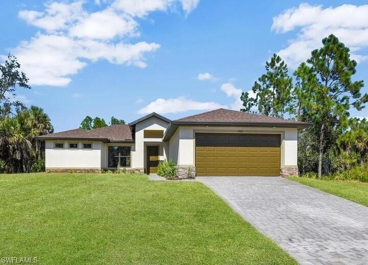 Welcome to the Islander, a beautifully crafted home custom built by Douglas Brooke Homes in 2023. This move-in-ready residence is completed and waiting for its new owners—best of all, there are no HOA fees!
Designed with entertaining in mind, the Islander features a true open-concept floor plan with seamless sightlines from the spacious kitchen to the great room. The home offers 3 bedrooms, 2 bathrooms, a 2-car garage, and a generous screened lanai for enjoying Florida living year-round.
The split-bedroom layout provides privacy, giving the owner's suite its own wing of the home. Premium finishes abound, including an extended paver driveway, oversized real wood cabinetry, a massive kitchen island, granite countertops throughout, porcelain tile flooring, a luxurious walk-in shower, stainless steel appliances, and elegant vaulted and tray ceilings.
Modern smart-home features include a video doorbell, Nest learning thermostat, Wi-Fi-enabled garage door opener, and an automatic sprinkler system.
Conveniently located gives you an easy commute to RSW International Airport, shopping, dining, hospitals, and entertainment, this home offers both luxury and accessibility.

Don't miss this incredible opportunity to own a nearly new custom home in a prime location. Schedule your showing today!