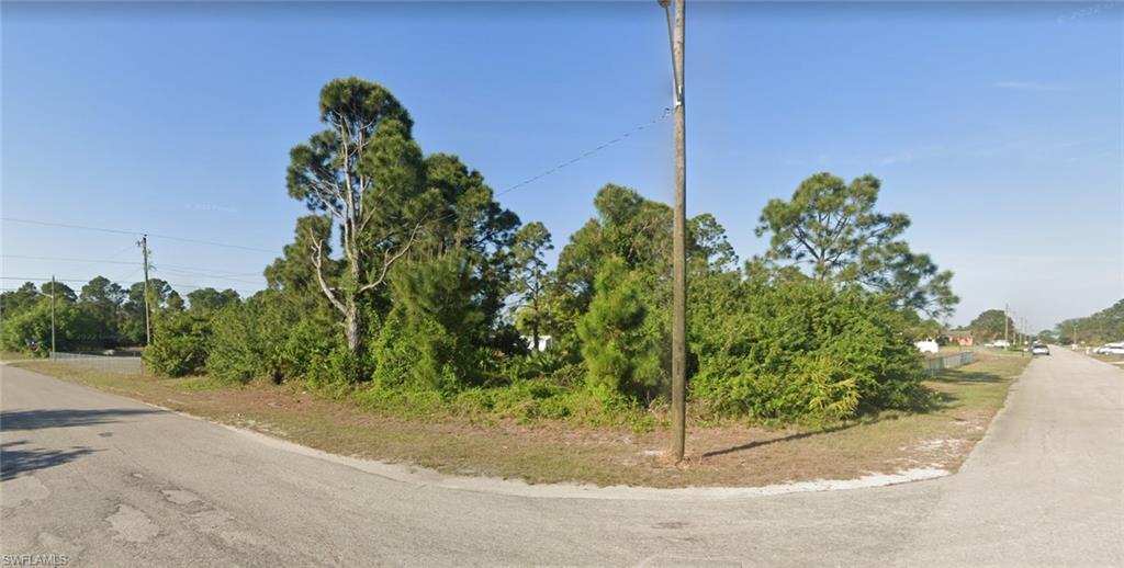 Exciting opportunity to build your dream home in sunny SWFL! This beautiful vacant corner lot in Lehigh offers a slice of paradise. Just 2 hours from Miami and Tampa, and 40 minutes from the beach! Enjoy nearby amenities like Westminster Golf Course, Dollar General, and Publix. Paved road access and only 15 miles from RSW Airport and downtown Fort Myers. Fully wooded, ready for your vision. Great for new home or investment. Buyer pays for title insurance. Grab this .25-acre  corner lot in a growing area surrounded by new construction. Start building your forever home or secure a smart investment today!
