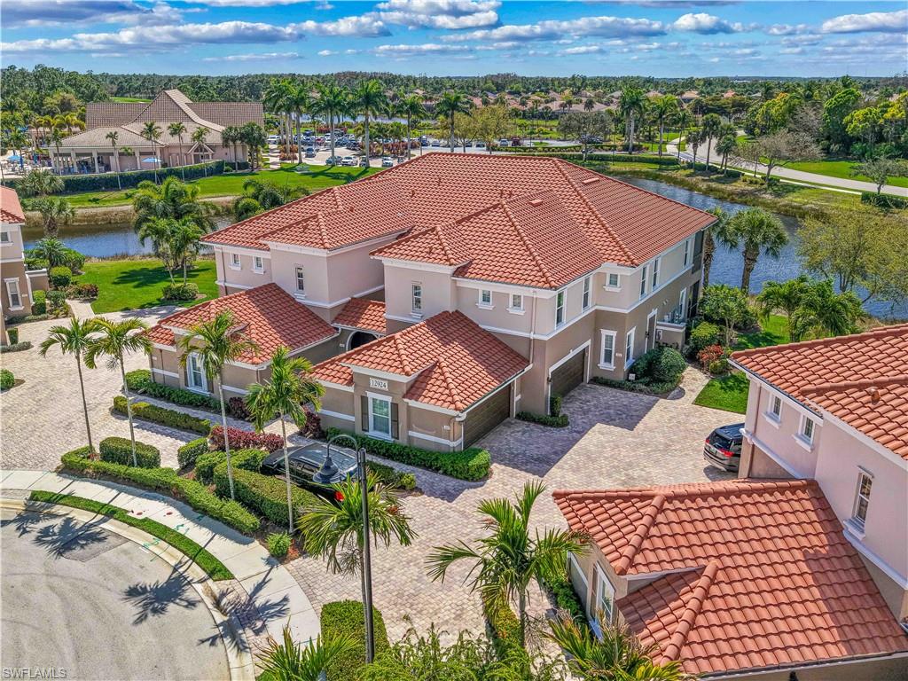 Lakefront sunsets, first-floor convenience, and move-in ready living this is one of Somerset's best values. Perfectly positioned with expansive western-facing lake views, this beautifully updated coach home offers the ideal blend of comfort, style, and low-maintenance living in the sought-after Plantation at Somerset. Featuring 2 bedrooms + a den (ideal as a home office or third bedroom), the open floor plan showcases a spacious kitchen with granite countertops, breakfast bar seating, and seamless flow into the living and dining areas. The standout feature is the enclosed all-season lanai, upgraded with acrylic sliding windows to create a true year-round living space where you can enjoy breathtaking sunset views over the lake. The primary suite includes private lanai access, a walk-in closet, dual vanities, a soaking tub, and a glass-enclosed shower. Recent updates include fresh interior paint, newer HVAC, new water heater, and luxury vinyl flooring in the guest bedrooms and den. Enjoy resort-style amenities including a pool, fitness center, spa, tennis, pickleball, bocce, and optional championship golf. Conveniently located just minutes from RSW Airport, Gulf Coast Town Center, I-75, shopping, dining, and everything Southwest Florida has to offer.