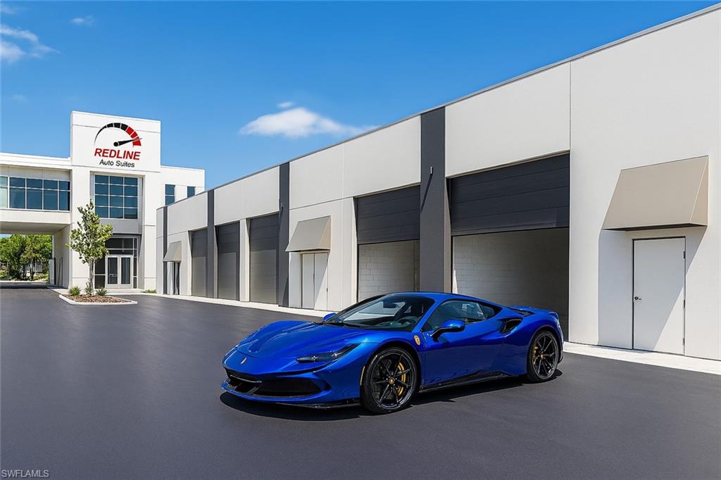 The Pinnacle of Automotive Luxury – Redline Auto Suites Units 1 & 2 - An unprecedented opportunity awaits the true connoisseur of automotive excellence. Units 1 and 2 at Redline Auto Suites are now offered for sale—with full architectural and interior design plans included to seamlessly combine both suites into a singular, state-of-the-art motor sanctuary. Envisioned with a floating mezzanine deck that spans both units, this is more than just storage—it’s a private gallery for your prized collection. Nestled within Naples' most elite motor condo community, Redline is a masterfully designed enclave of only 18 private auto suites, each crafted for those who live and breathe the car-culture lifestyle. This offering boasts approximately 2,000 square feet of open floor space, with the potential for 600 additional square feet of elevated loft space, perfect for a high-end lounge, office, or observation deck overlooking your personal fleet. The oversized 16’ wide x 14’ high roll-up garage doors welcome everything from supercars to custom transporters, while the interiors are delivered as a premium shell, ready to be transformed into your bespoke vision—whether that includes polished epoxy floors, glass-enclosed lounges, full bar and cigar humidor, or wall-to-wall automotive memorabilia. Each suite includes: (1) Pre-plumbed private restroom (2) Advanced HVAC with air-handler closet (3) Utility-ready water bib (4) 24/7 access and modern security infrastructure. Above the auto court, owners enjoy exclusive access to Redline’s Club Room - a dramatic, glass-wrapped lounge reminiscent of a speedway’s VIP grandstand suite. With panoramic views of the entire facility and curated social gatherings, the Club Room is a place where passion meets prestige. For the collector who demands more than just space—for those who seek experience, expression, and identity - this is your automotive sanctuary redefined.