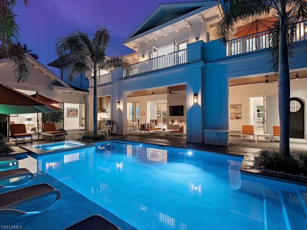 Incredible opportunity to acquire a home built to the most exacting of standards & located in the ideal, beach-side setting of Old Naples; just 6 homes to the sand. This quiet, mahogany tree lined street is one of the most picturesque settings in Old Naples. The full-size lot, with alley access, afforded the architect the ability to perfectly position the pool on the southwest side of the property for maximum enjoyment of the sun year around; enhanced by the ample lava stone hardscape. Fantastic, covered outdoor living areas protected by retractable screens and shutters come complete with outdoor kitchen, separate dining and lounging areas, & a linear fireplace. Discovering the interiors the home features Legno Bastone French white oak flooring, comfortable great room floor plan, finely appointed kitchen with Sub-Zero, Wolf, Miele, & bespoke cabinetry with waterfall marble island. Solid concrete construction; block first and second floor walls with a solid poured second floor for incredible structural integrity. Low voltage lighting system, security cameras & Sonos sound system. The 3 car garage offers lifts in 2 bays for the collector's 5 car situation. A truly unique offering.