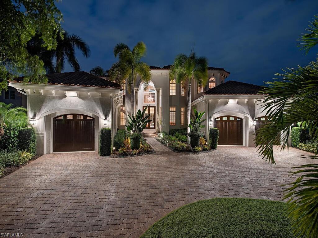Situated in the highly sought after neighborhood of Park Shore. Boasting approximately 120ft. on Venetian Bay provides for incredible water views, a boat lift, and two wave runner lifts, allowing easy access to the Gulf of Mexico. This pristine 5 bedroom plus theater, 6 full bath home offers a bright open floor plan with natural light flowing through large windows and walls of glass sliding doors. Elegance abounds with an epicurean kitchen, unique tray ceilings, 2 story dining room with stunning new custom wine cellar, with both 1st and 2nd story covered lanais. The expansive outdoor living area encompasses a lovely outdoor kitchen complete with an Evo grill,  pavers and Ipe decking, fire and water bowl features flow into the beautiful pool and spa. It is great for entertaining or relaxing as this home lives seamlessly from the inside to the outside year-round. This home has been continually enhanced throughout, including the Savant home automation system.