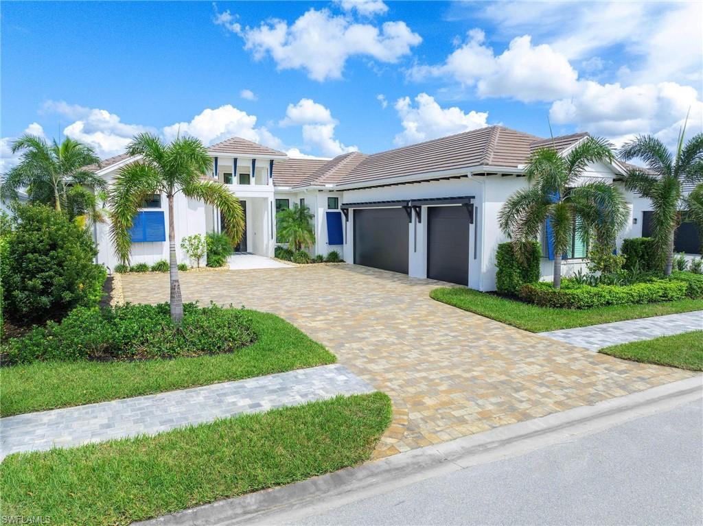 FULL GOLF MEMBERSHIP & ACCESS TO OVER 250 TPC COURSES WORLDWIDE THROUGH TPC PASSPORT PROGRAM. RECENTLY REDUCED 100K AND NOW OFFERED FULLY FURNISHED WITH ALL ACCESSORIES (220K VALUE)

Experience the Pinnacle of Luxury in Treviso Bay’s Exclusive Peninsula. Welcome to an unparalleled estate home in the prestigious Peninsula at Treviso Bay—a residence that redefines luxury and sophistication. This award-winning, custom home boasts exquisite designer finishes and high-end furnishings from Robb & Stucky, Baer’s, Bernhardt, and Natuzzi, seamlessly blending elegance and comfort. Offering 4 spacious bedrooms, 4.5 impeccably designed baths, and an expansive 5,100 square feet of masterfully crafted living space, this estate is the epitome of grandeur. Step into the wide-open great room, where soaring ceilings and a 24-foot fully retractable floor-to-ceiling glass wall reveal breathtaking views of the tranquil lake and the signature 8th hole of the TPC golf course. Thoughtful details such as a backlit ceiling, custom-built entertainment wall, and a dazzling bar with an under-counter Sub-Zero wine cooler make this home an entertainer’s dream. Karastan wood floors throughout add warmth to the open-concept design. The gourmet kitchen is designed for the discerning chef, featuring a 48-inch Z-Line gas range with double ovens, Wolf wall oven, Sub-Zero refrigerator, double-thick quartz countertops with custom spice/ baking sheet storage and a large walk in pantry. The primary suite features a triple cloud backlit ceiling, cozy sitting area, and custom built-in closet cabinetry. The spa-inspired bath boasts an expansive shower with three showerheads and a freestanding tub, creating a serene retreat for relaxation. All three guest bedrooms feature walk-in closets and beautifully appointed walk-in showers, ensuring comfort and privacy for family and visitors alike. The third guest bedroom can be converted into a study and has a full bath which also serves as the pool bath. Designed for seamless indoor-outdoor living, the lanai offers a full outdoor kitchen and dining area, spacious seating with a large TV, outdoor fireplace, lush maintenance-free artificial turf, and a spectacular pool and spa with elegant landscape lighting. Built with Aercon commercial-grade block and spray foam insulation, this home ensures year-round energy efficiency. Beyond the home, Treviso Bay offers an unmatched lifestyle with privileged access to the TPC golf course, resort-style amenities including a resort pool with restaurant and bar, spa, casual and fine dining at the golf clubhouse, 8 Har-tru tennis courts, 8 pickleball courts, 3 bocce courts and a world-class fitness center. The beautifully gated community features miles of scenic trails and golf-cart-friendly paths, all just minutes from Naples and Marco Island’s white-sand beaches, upscale shopping, and gourmet dining. Call today to schedule your private tour and experience the elegance of Treviso Bay firsthand!