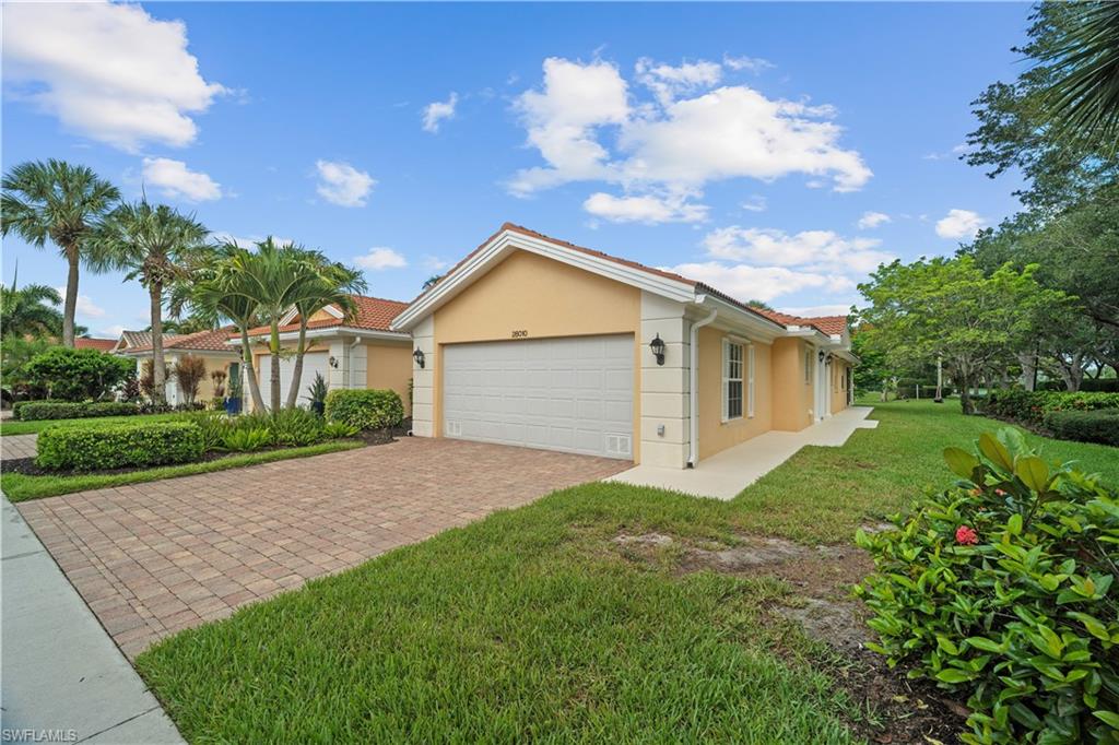 One or more photo(s) has been virtually staged, AI generated or rendered.  Welcome to San Remo, a gated enclave within the Palmira Golf Club community, conveniently located just east of Interstate 75 off Bonita Beach Road. This freshly painted 2 bedroom, 2 bath villa offers 1,540 square feet of living space, a two-car garage, and a screened lanai with a calming lake view. Step inside to soaring ceilings and an open, airy feel. The split bedroom design gives guests their own private wing, while the generous master suite is tucked away for quiet mornings and restful nights. A bright kitchen anchors this home for casual meals or entertaining.  Slide open the doors to the screened lanai and enjoy the relaxing lake views. San Remo also features community amenities including: a clubhouse and pool, plus fitness, pickleball, and tennis. From this Bonita Springs address, you are close to Gulf beaches and nature preserves. Shopping is equally convenient with everyday essentials nearby, along with a variety of restaurants ranging from casual local favorites to fine dining. Move-in-ready home that balances space, privacy, and low-maintenance comfort in a prime Bonita Springs community.