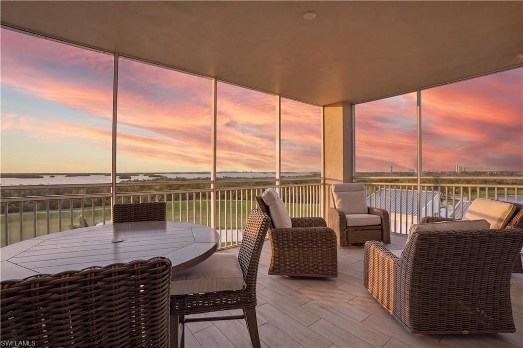 Do not miss this STUNNING THREE-PLUS-DEN END UNIT residence in the highly sought-after Seaglass tower in Bonita Bay, offering sweeping gulf, bay, and golf course views. Upon entry, you are welcomed by a private elevator foyer and immediately drawn to floor-to-ceiling glass windows and AMAZING views. This unit is spacious and sophisticated, offering over 3,400 square feet under air with THREE bedrooms PLUS a den and FOUR baths. Designed for both comfort and entertaining, this residence features a modern open-concept floor plan with seamless flow between the kitchen, dining, and living areas. Be impressed by the LUXURIOUS finishes and attention to detail throughout, including custom light fixtures, a built-in entertainment center with an electric fireplace, and abundant floor-to-ceiling windows offering a ton of natural light. You will enjoy preparing meals in the well-appointed kitchen; guests will love to gather around the large island! Barely used stainless steel Thermador appliances include a gas cooktop, oven and HUGE refrigerator. The expansive screened lanai offers SO MUCH ROOM for outdoor living, dining and enjoying breathtaking western sunsets, complete with a built-in gas grill. The primary suite is a private retreat with direct lanai access, two custom walk-in closets, dual vanities, a soaking tub and a spacious walk-in shower. Guest bedrooms offer en-suite bathrooms, custom closets and private balconies. A spacious den or office adds flexibility - this space can also be utilized as a bedroom when extra guests are visiting. This residence truly lives like a single-family home. Additional features include a private elevator entry, two designated parking spaces and on-site storage. Seaglass offers luxury high-rise living with resort-style amenities including  a gorgeous pool and spa, fitness center, theater, rooftop terrace, private guest suites and a secure lobby with 24 hour attendance. Residents of Bonita Bay enjoy an unmatched lifestyle with access to a private beach club, kayaking and canoeing, pickleball and tennis, multiple parks, and more than 12 miles of walking and biking paths. Golf enthusiasts will appreciate five championship courses, along with multiple dining venues, a state-of-the-art fitness center, and a full-service marina (club membership required; additional fees apply). Ideally located just minutes from world-class dining, shopping, beaches, and nature preserves, with easy access to Downtown Bonita Springs, Downtown Naples, and RSW International Airport, this residence offers the perfect balance of luxury, convenience, and coastal living.