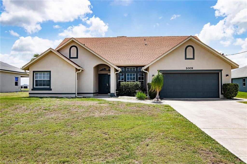 Wow! Very nice, custom built POOL home in fast growing NW Cape Coral! MOTIVATED SELLERS! Spacious floor plan with cathedral ceilings, split bedrooms, inside laundry, and big eat-in kitchen! 3/2 built in 2009 with 1,987 sq ft of living area! 3-year-old roof, recently painted in & out, some new flooring, brand new pool pump, new faucets & more! Good sized, permitted, storage shed in the back! Wood burning fireplace! Nice sized lanai with electric roll-down storm shutters! Large pool with massive mansard pool cage! Eat-in kitchen has breakfast bar, solid surface tops, breakfast nook and pocket sliders to the pool area! Master bedroom has double door entry, vaulted ceiling, HUGE walk-in closet and sliders to the pool area! Master bath has dual sinks, shower and separate tub! Inside laundry room with laundry tub. Outlet for whole-house generator. High rooflines! Plenty of storage, ceiling fans, and art niches! Move-in ready! you don't want to miss this one!