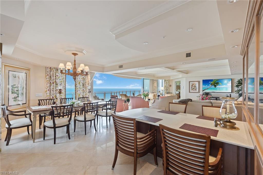 Gorgeous Gulf and beach views. Rarely available, higher-floor end unit directly on the beach in the private gated community of Bay Colony in Pelican Bay. Featuring panoramic views of the Gulf of Mexico through a floor-to-ceiling sliding glass door that opens onto a spacious wraparound lanai. This highly sought-after floor plan welcomes you into an elegant entry foyer with a spacious living and separate dining area. Open kitchen and den offer plenty of room for entertaining family and guests, along with three full bedrooms, all with en-suite baths. The Brighton amenities include a designer-renovated lobby with a 24-hour manned front desk, guest suites, fitness center, social room and a resort-style pool. Bay Colony residents enjoy the use of their own private, renovated beach club and restaurant, a tennis club, as well as the use of the amenities of Pelican Bay. Private golf memberships are available separately.