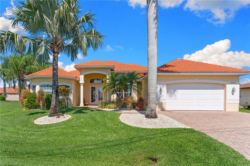 Fantastic opportunity in the Palaco Grande neighborhood! Spectacular 3 bedroom , 4 and 1/2 bath Water Direct estate home with a beautiful pool and spa, wonderful western exposure and blissful sunset views. Palatial master bedroom suite with pool bath at one end and a luxurious master bath at the other. Both guest bedrooms have en-suite baths and have very generous proportions. The oversize kitchen will be a delight for any aspiring chef. Excellent dock and lift and your own private Tiki Hut at the water's edge This home has been maintained to the highest degree and feels like a new home from the moment one enters. 
Best of all, the idle time from the dock to the Caloosahatchee River is a matter of minutes, literally just about 1/4 mile.
Come see the best of what South West Florida has to offer, fall in love, and move right in.