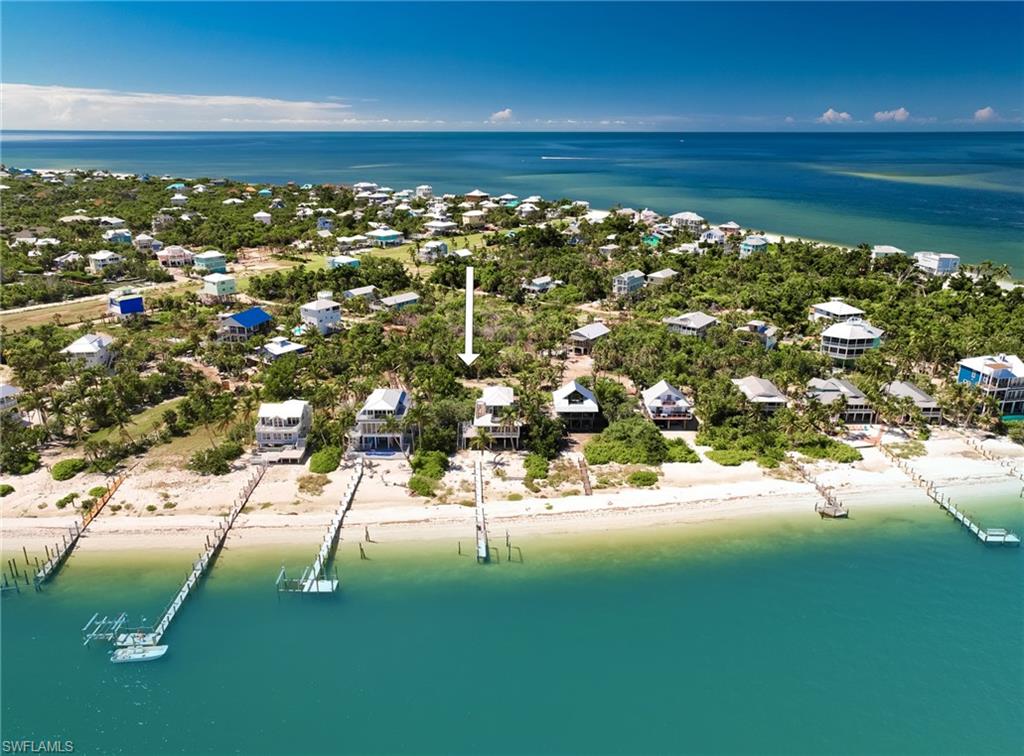 Gorgeous, Unique, and Private estate-sized corner lot on North Captiva with plenty of room to build your island dream house! With just one row of homes to the bay, you will have impressive bay and sunrise views from the uppermost levels of a well-designed reverse floor plan home.