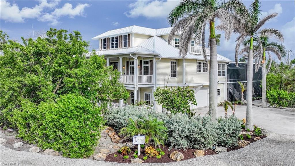 Welcome to the Palm & Shell. A rare opportunity to purchase an estate home on Captiva within South Seas Resort.  This stunning home was completely renovated with quality craftsmanship and attention to every detail--from coastal themed bedroom names to airy island decor' and artwork throughout. Featuring a soaring, 2 story entry, 10 ft ceilings throughout, luxury interior furnishings, custom kitchen cabinetry, large walk-in pantry, spacious laundry, stunning checkerboard porcelain tile throughout, carpeted bdrms, and a brand new 3 story elevator.  The spacious chef's kitchen features a huge peninsula, an island w/ electric, downdraft cooktop, wall oven & microwave, refrigerator/freezer, DW, and fully stocked kitchen with Nespresso, Keurig, fully stocked kitchen including service for 16--dinner &  flatwear for interior or al fresco dining.  Enjoy beach peeks from the kitchen windows.  Dining room seats 12 w/ add'l counter seating and 4 person breakfast nook.  The open living room was made for family time--featuring plush couches, armchairs, electric fireplace, dual ceiling fans, & built-in library shelves and media/game cabinets.  The star of the main level is the living room's wall of French doors, all of which open to a sprawling, screened-in balcony overlooking the pool & grounds.  The main level features (3) bedrooms--a queen jr suite w/ en-suite bathroom & balcony, double full BR and queen BR with their own neighboring bathrooms.   The 3rd floor is the penthouse style primary bdrm--featuring a sitting area & desk, luxurious bathroom suite w/ full body showers, whirlpool tub, on-demand hwh, dual sinks, quarty vanity, lighted mirror and spacious closets.  The primary suite's private deck enjoys both Bay & Gulf views--perfect for enjoying sunrise coffees and evening sunsets.  The BR next to the primary makes a perfect home office or child's bdrm and features a wet bar and private balcony with gulf views.  The soaring 2 story lanai features panoramic screens and offers the very best of outdoor Gulf living.  Its extra large, heated pool and spa with waterfall feature, nighttime lighting, basket & volleyball nets, multiple lounge chairs, gas grill, large dining table, and entertaining area make it the heart of the home.  Additional features:  standing seam metal roof, work shop & large storage, space for bikes/kayaks/fishing gear/beach toys, oversized two car garage w/ space for golf carts, impact glass doors and windows AND add'l layer of motorized shutters, indoor fire sprinklers, shell driveway, tropical landscaping w/ pops of color and a beach path to the private South Seas Beach.  This gorgeous, one-of-a-kind Captiva home has it all - luxury, location and lifestyle.  Please call for a private viewing.