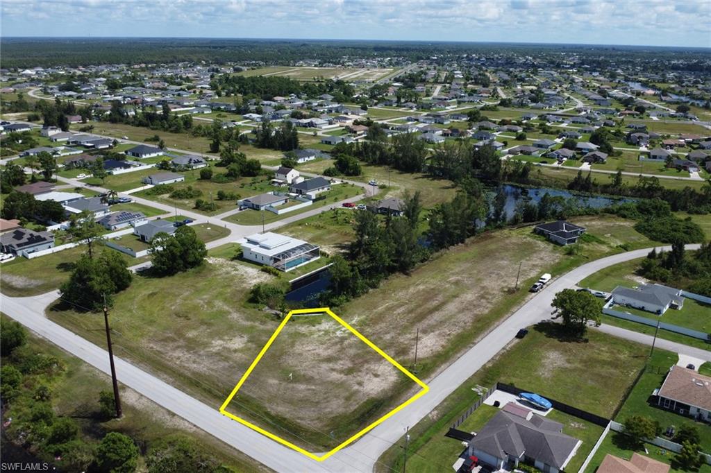 Seize this extraordinary opportunity to own a sprawling 14,000 sqft lot, encompassing 0.33 acres of prime real estate in this booming section of Cape Coral. Situated on a freshwater canal with a seawall in place, this lot is the perfect canvas to build the masterpiece home you've always dreamed of. Zone X, no flood insurance required! The adjacent lot at 807 NE 38th Ter and 3819 Andalusia Blvd, is also available for purchase, combining for nearly an acre of land. Build a single grand estate or multiple homes. This is a rare chance to secure a large parcel in a rapidly growing area. Whether you envision a luxurious single estate or multiple homes, the possibilities are endless. No assessments due at this time. Inquire today for more details!
