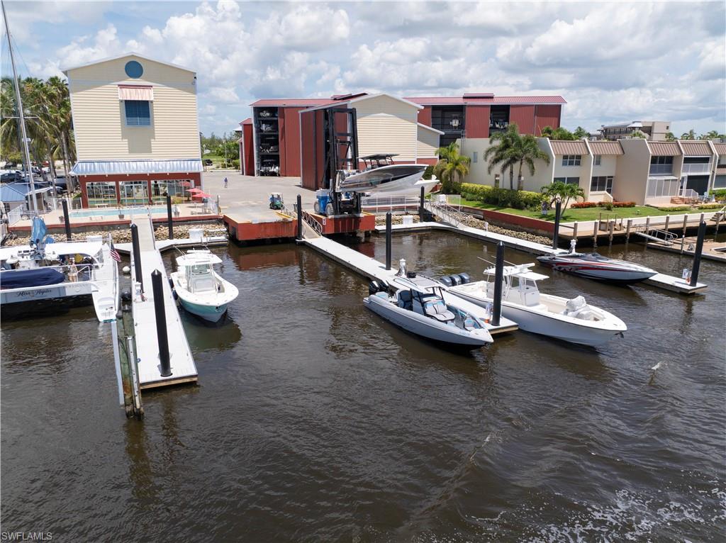 Enjoy effortless boating from this premium dry-storage slip, perfectly suited for vessels up to 27 feet in length, 9' 6" in beam, and 6 feet in height, with a maximum wet weight of 5,000 pounds. Ideally positioned for quick, unrestricted access to the Gulf of Mexico with no bridges to navigate, this location makes it easy to spend more time on the water and less time preparing to get there.

Designed for convenience, the marina offers a true valet-style boating experience. Simply schedule your departure, and your boat will be launched, fueled, and stocked with ice upon request, ready and waiting when you arrive. Upon your return, the marina staff handles retrieval and secure storage, eliminating the hassles associated with traditional dock ownership.

Owners enjoy access to a variety of first-class amenities, including a heated pool, private clubhouse, abundant parking, and on-site ice service. The covered dry-storage environment helps protect your vessel from sun, weather, and marine exposure while providing added security and peace of mind.

Whether you're an avid angler, weekend cruiser, or seasonal resident seeking a convenient boating solution, this rarely available slip presents an outstanding opportunity to enjoy a low-maintenance waterfront lifestyle in one of Naples' most sought-after boating destinations.