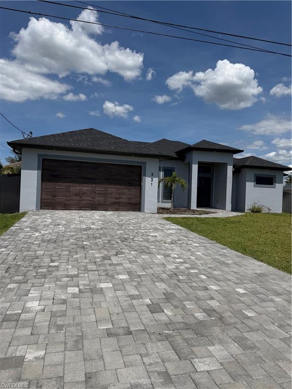 JUST REDUCED!!!Welcome to this stunning 2024-built home, offering 4 bedrooms, 2 full bathrooms and 1 half bath, and connected city water service. Designed with modern elegance and comfort in mind, this beautiful residence features soaring ceilings, gorgeous tile flooring throughout, and an open-concept layout filled with upscale finishes.

The spectacular kitchen serves as the heart of the home, showcasing contemporary design, quality cabinetry, and ample space for entertaining. The bathrooms are equally impressive, featuring modern toilets and stylish illuminated mirrors with integrated LED lighting. The spacious laundry room includes a utility sink and custom cabinetry for added convenience and storage.

Every bedroom, as well as the living room, is equipped with modern ceiling fans that enhance both comfort and style throughout the home.

Step outside and enjoy the convenience of a well-appointed outdoor kitchen, perfect for entertaining guests, family gatherings, or simply enjoying Florida's outdoor lifestyle year-round. The property also features a privacy fence, creating a comfortable and secluded backyard retreat.

Additional upgrades include a garage door opener and a professionally finished epoxy-coated garage floor, providing both durability and a polished appearance. For added peace of mind, all windows and doors—including the front entry door and sliding glass doors—are impact-resistant and hurricane-rated.

Located in a beautiful neighborhood surrounded by attractive newer homes, this property offers outstanding curb appeal and a welcoming community atmosphere. Even better, you'll be less than two minutes from Publix, restaurants, gas stations, pharmacies, and a variety of shopping and everyday conveniences.

This exceptional move-in-ready home combines modern design, quality construction, premium upgrades, and an unbeatable location.