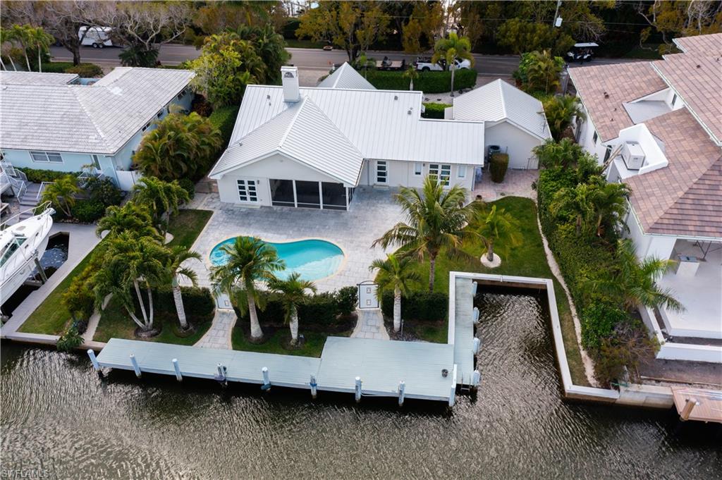 Rare waterfront homesite opportunity in Aqualane Shores, one of Naples’ most prestigious and sought-after boating communities. Positioned along a scenic canal with direct Gulf access, this exceptional property offers an extraordinary setting for a future custom waterfront estate in a location synonymous with luxury coastal living.

Surrounded by newly constructed luxury residences and some of Naples’ most valuable real estate, the property embodies the very best of the Naples lifestyle. Boating enthusiasts will appreciate convenient access to Naples Bay and the Gulf, while those seeking walkability and charm will enjoy being just moments from the renowned dining, boutique shopping, galleries, and cafés of Third Street South, Fifth Avenue South, and Naples’ world-famous white-sand beaches.

The existing residence has been thoughtfully maintained and features a newer roof, allowing for immediate enjoyment while plans are considered for the future. Whether renovating, reimagining, or creating a custom waterfront retreat, the possibilities are exceptional.

Opportunities to secure a premier waterfront address in Aqualane Shores are increasingly rare. Create a legacy property in one of Naples’ most iconic neighborhoods, where boating, beachside elegance, and downtown sophistication come together in perfect harmony.