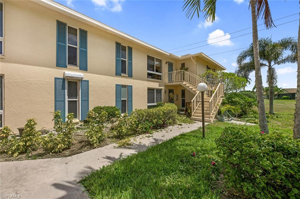 Move right in, no renovations needed on this beautifully renovated 2nd floor condo in the Glades Golf and Country Club.  This condo has a Coastal Farmhouse feel and features a custom Cambria Montgomery Double waterfall countertop and granite composite kitchen sink and wine cooler. Artisan handmade pendants hang over bar counter area! Craftsmen interior custom grey doors with designer hardware complete the look. Master bedroom bathroom has a floating vanity with double vessel sinks, designer mirrors and chandelier. Guest bathroom has an oak vanity with designer sink and coastal beaded chandelier. Double screened lanai has plenty of space for relaxing and dining. The Glades Golf & Country Club is a bundled golf community with two recently renovated Gordon Lewis designed golf courses, a par 70 The Pines and a par 55 The Palmetto Other amenities include pickleball, tennis, bocce, shuffleboard, 19th Hole restaurant and clubhouse with many activities during season.  Only 10 minutes from downtown 5th Ave shopping and dining district and the beautiful beaches of Naples! Rheem AC 2017, and Rheem Hot Water Heater 2016.