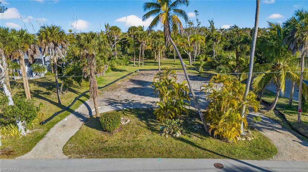 Amazing opportunity to own over a half-acre on a charming street tucked just off Periwinkle Way, within easy walking distance to local shops, restaurants, and the island bike path. This spacious homesite offers the ideal foundation to bring your vision to life - plenty of room for a custom island home and pool, all in a convenient, yet private setting. Enjoy having island amenities at your fingertips, and hop on your bike for a quick ride to the white sandy beaches, world-class shelling, and unforgettable sunsets. Don’t miss your chance to secure a piece of paradise!