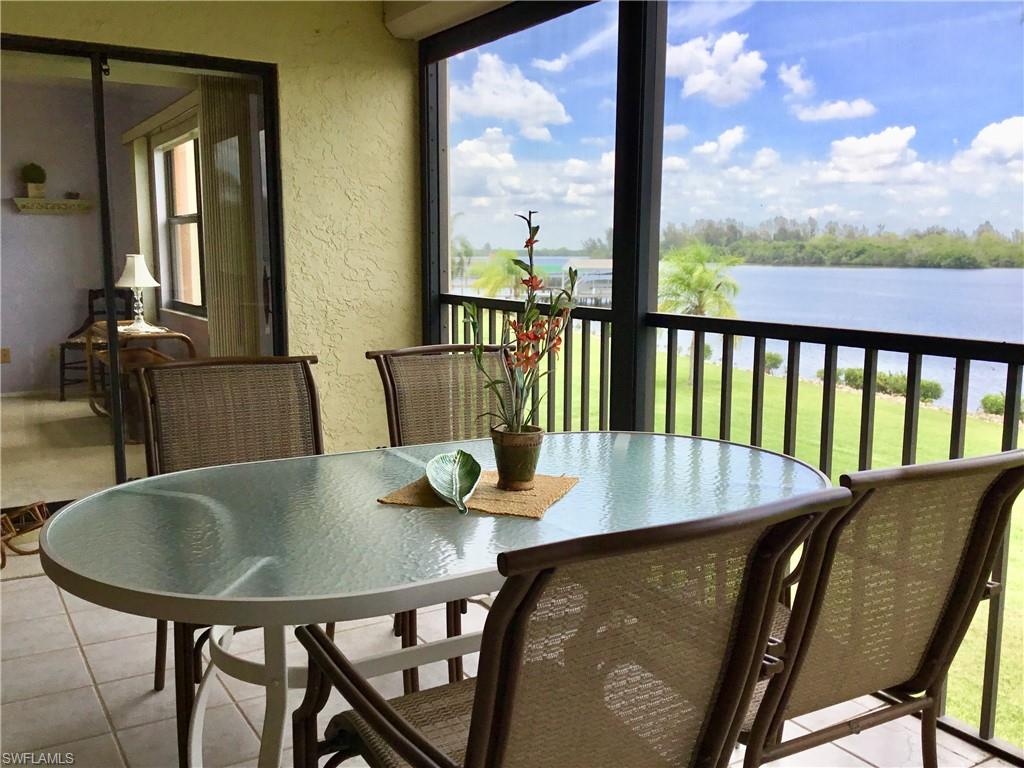 Hidden gem in North Fort Myers! Gulf Access BOATING community to call your winter home or enjoy the beauty of this community year round! There are so many things that make this particular unit special. Water, Water, Water! Beautiful fountain feature in the lake out front and an unobstructed view of the active Caloosahatchee River/Intracoastal Waterway out back with DOLPHINS AND MANATEES, as well as every imaginable watercraft, that will pass by for your viewing pleasure.  Electric HURRICANE SHUTTERS on screened in lanai and impact windows are in place to protect your property when "hunkering down" is advised.  TURNKEY! Move in with just your suitcase and a toothbrush. Beautiful GRANITE COUNTERTOPS in the fully equipped kitchen. WINE COOLER - REVERSE OSMOSIS for drinking water, no lugging pallets of water bottles from your car. New A/C and Water Heater!  Washer and Dryer. Energy efficient, being tucked into the middle of the building on the second floor.  A must see!  Did I mention the fantastic view!