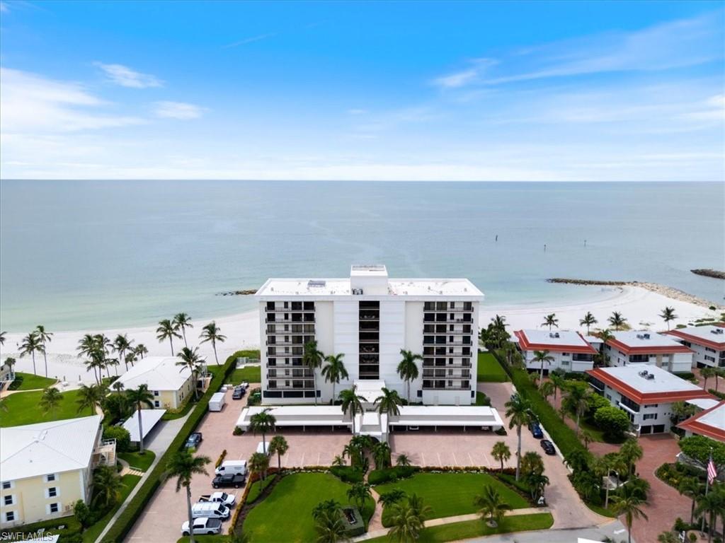 Welcome to Unit 701 at Gulf View Beach Club—a rare beachfront residence offering nearly 3,000 square feet of light-filled living space directly overlooking the Gulf of Mexico. This spacious corner unit is designed to maximize sweeping west-facing views, with walls of glass that open to a private balcony where you can enjoy Naples’ legendary sunsets and the soothing sounds of the surf. The boutique-style building offers an intimate setting with exceptional amenities, including a beachfront pool and patio, private beach access, social and fitness rooms, individual owner storage, and paddleboard/kayak racks. An on-site manager ensures a seamless lifestyle so you can spend more time relaxing on the beach or entertaining with friends and family.