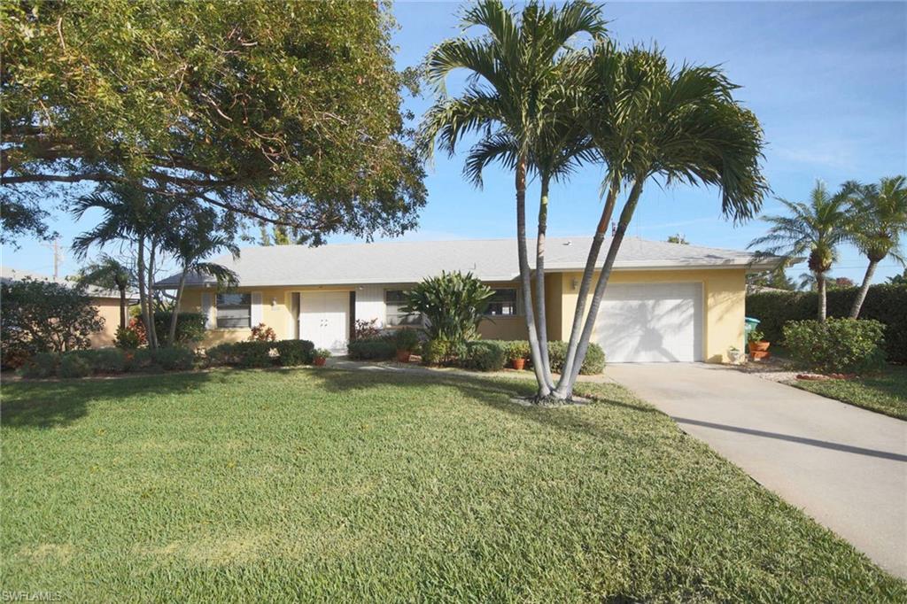 A jewel with a pool! Bright and airy immaculate home. This cheerful sunny home has been well maintained and updated over the years by original owners. Enter through double doors into light tiled great room leading to family room with vaulted ceilings over looking the sparkling pool with recent updated diamond bright finish. The entire home has light tile floors for easy care. The spacious kitchen has extra tall white contemporary cabinets and abundant counter space for all of your entertaining. The delightful home also features many custom built ins for extra storage including book shelves unit in living room and third bedroom. The design of the well located SE home is split for privacy with spacious master bedroom on one side with plantation shutters and guest suites on other. Updates include: dimensional shingle ROOF in 2011 w/warrantee, 2015 AIR CONDITIONER, 2017 NEW PLUMBING . The family room with tall ceilings is enhanced by multi windows overlooking the pool with waterfall. Enjoy morning coffee sitting on your patio and looking over the lushly planted back yard. Convenient location near shopping, movie theater, restaurants.  ALL UTILITIES IN & PAID, desirable FEMA "B" zone.