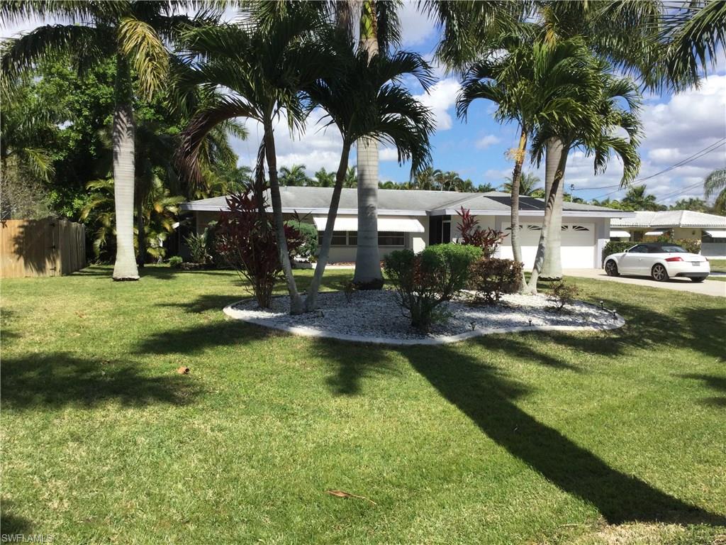 Location..Location..Location!    REDUCED $10,000.00. Value packed river views at this gorgeous yacht club location directly across from the river on royal palm tree lined street. Spacious solar heated pool home with generous sized bedrooms, 2.5 baths, formal living/dining plus family room. The kitchen has tiled backsplash, newer appliances and a large walk in pantry. Both full baths recently renovated with new tile and vanity. This is the perfect home to make into your HGTV dream home. You'll never find a better location !