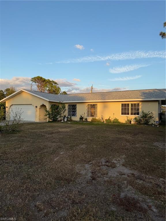 Welcome to this charming single-family home in Port Charlotte! Situated between two vacant lots, this 3-bedroom, 2-bath residence offers approximately 1,646 sq ft of living space on a 9,997 sq ft lot featuring a new roof, new garage door, new slider, new electrical panel and new kitchen! The home features a split floor plan with the master suite located separately from the guest bedrooms for added privacy. Inside, enjoy an open layout with separate living and family rooms, and a newly renovated kitchen with granite counters, a breakfast bar, and a large pantry. Flooring includes tile and newer laminate, with no carpet throughout. A slider off of the family room opens to the patio and spacious fenced backyard, complete with fruit trees—perfect for outdoor living and entertaining! Additional highlights include an oversized attached garage and city water/sewer. Centrally located in sunny Port Charlotte, you’re minutes from dining, shopping, and everyday conveniences. Just a few finishing touches and you can call this home sweet home!