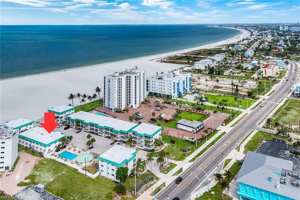 THIS is the winter escape you have been waiting for! Centrally located on Fort Myers Beach and steps away from the beach, this two-bedroom, two-bathroom end unit has been tastefully updated. The home boasts white shaker cabinets, quartz countertops, stainless appliances, luxury vinyl wood-look flooring throughout, hurricane impact windows and doors, and so much more! Upon entering, you will notice the open-concept floor plan allowing for an abundance of natural light. The primary suite features plenty of room for a king-size bed and an ensuite bathroom with a stunning walk-in shower. The second bedroom can be utilized as a guest suite or additional living area. Spend your winters enjoying the Gulf breeze and white sand beneath your feet. The community pool is also located just steps away from this home and the beach. This is Florida living at its finest. The Privateer is located minutes from some of Fort Myers Beach’s finest restaurants, grocery stores, and more. Don't miss your opportunity to experience everything this incredible home and community have to offer!
