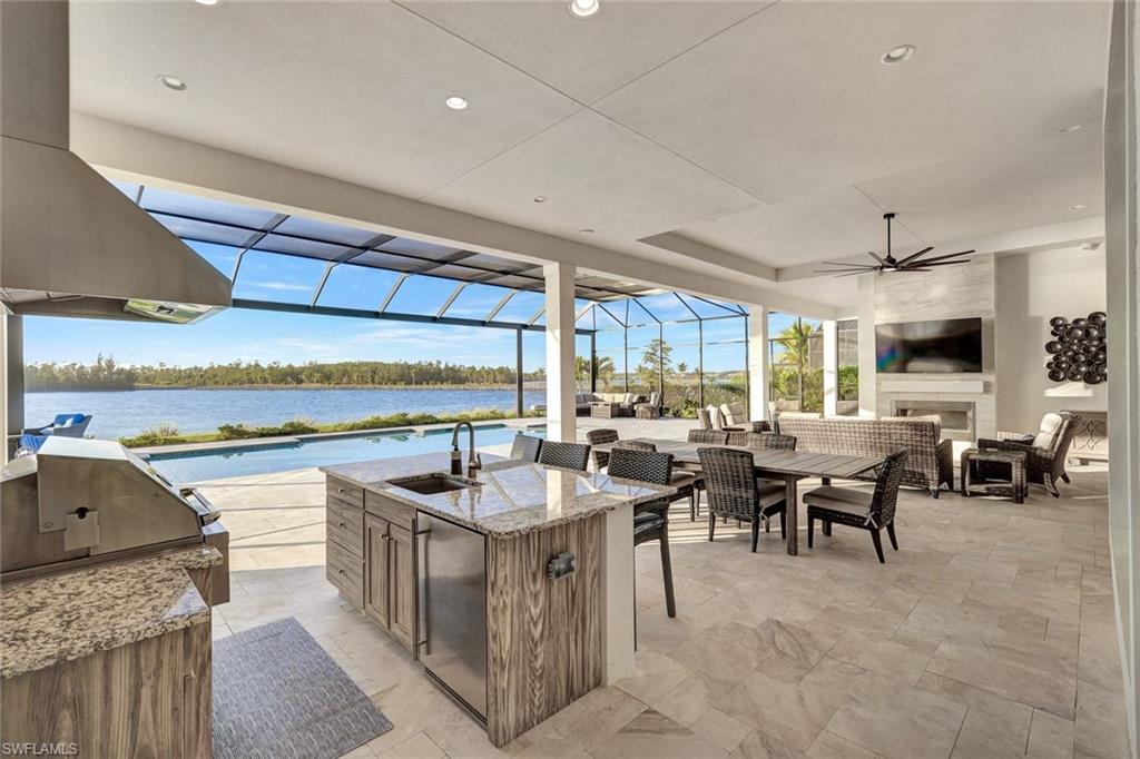 Move in ready!   Imagine living in this Regency Manor iii Stock luxury home in WildBlue, a one-of-a-kind gated community between Naples and Fort Myers.  This home is in a prime location on expansive Wild Blue Lake, the area's largest of three deep-water, spring-fed lakes. With an average depth of 37 feet, this pristine lake is a haven for boating, wakeboarding, paddleboarding, fishing, and endless water recreation.

18130 Blue Eye Loop is one of only 20 homes on the peninsula circle, positioned to capture the tranquility of the natural coastal preserve to the east. Enjoy ultimate privacy with unobstructed views – this pristine landscape will never be developed. Experience unrivaled water views from the primary bedroom suite, the great room, the kitchen, and the second bedroom/bonus room ensuite.

This stunning contemporary home offers exquisite custom upgrades, creating a one-of-a-kind living experience. The bright and spacious great room interior, with 13-foot ceilings, is designed for comfort and style. Extend your living space outdoors with the 15-foot wide nesting sliders. The residence is built with concrete blocks and features impact-resistant windows and doors for superior storm protection. The expansive lanai, one of the largest in the community, is perfect for entertaining or relaxing. The property sits on just under half an acre lot and offers over 1,070 square feet of outdoor living space. It also features a custom pool and spa with a picture window screen, allowing you to unwind while enjoying panoramic views of the boatable lake. A dock can be added with approval. The outdoor living area offers a built-in kitchen and a TV seating area with a natural gas fireplace.  

Living in WildBlue means access to many amenities and a vibrant, active lifestyle. With over 800 acres of freshwater lakes and a community that offers everything from boating and water sports to tranquil nature walks, there's something for everyone.   The luxury amenities include a restaurant and poolside bar, full-service spa, tennis and pickleball courts, exercise room, a dedicated lap pool, a resort-style pool, a lakeside beach, bocce, a playground, kayak and boat launch and social activities.

This home's location puts you at the center of it all. Within a short 3.6-mile radius, you'll find a variety of restaurants, grocery stores, pharmacies, Miromar Outlet Mall, Gulf Coast Town Center and everything else you need for everyday life. Plus, you're just a quick 11-mile drive from the Southwest Florida International Airport (RSW) for easy travel connections and Florida Gulf Coast University FGCU) is just around the corner.   Don't forget our award-winning SWFL beaches are just a short drive away.

Don't miss this opportunity to join this lively lakeside community. Contact us today to schedule a private tour of this exceptional custom home and discover why WildBlue is the ultimate destination for luxury living in Southwest Florida.