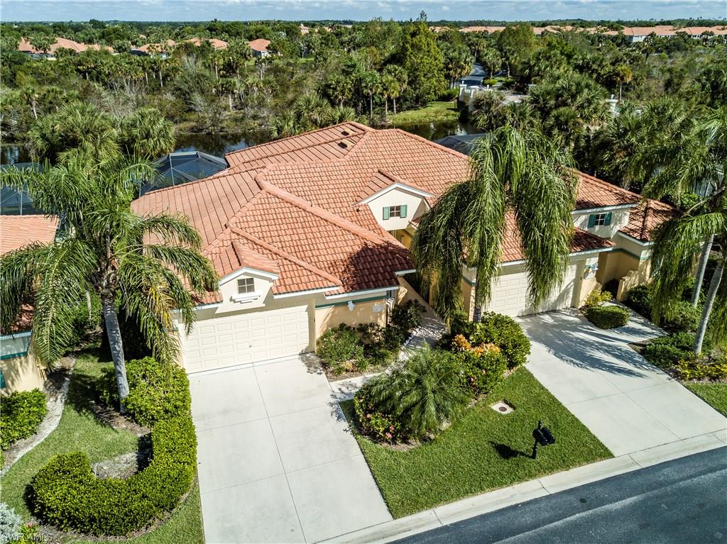 Former Model -Immaculate & pristine attached villa with fabulous lake and fountain view.  Spacious kitchen  complete with island, granite countertops, tile backsplash, newer Samsung stainless steel appliances, GE dishwaser, eat-at-bar, under cabinet lighting and pantry.  Master Bedroom and Guest features wood flooring.  2- Car Garage has upgraded Garage Tek wall storage.  Large pool and spa plus outdoor kitchen complete your outdoor enjoyment and entertaining.  Best of all this lovely villa is complete with hurricane protection on all sides. (One original owner.)
The 100% Lakefront community of Lighthouse Bay is an amenity-rich community with 44 acres of lakes, 70 acres of greenspace and 26 acres of wildlife preserve, 5 picturesque cobblestone bridges, and 32 fountains. 
Enjoy the 5 POOLS- an 82 foot lap pool in Swimming Atrium, Lagoon Pool is 2500 square foot freeform with rock waterfall and spa, plus 3  cabana pools, 6 lighted HydroCourt tennis courts, Bocce Court, Health Club with cardio exercise area, Massage room, Boathouse with lighthouse, paddle boats, canoes and fishing boats.
Freshwater Sunning Beach,  3 Miles of Walking Paths, and 10 acres of Old Florida nature park.