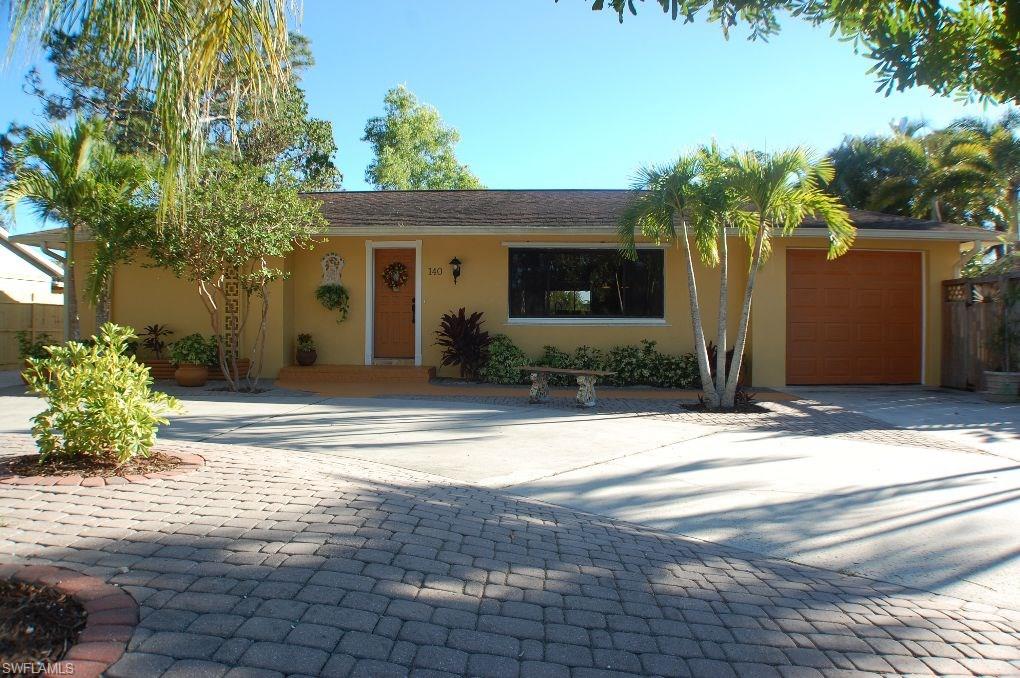 Back on the market.   Desirable Bonita Shores location.  Only 1.1 miles to beautiful Barefoot Beach.  3 Bedroom/2 Bath pool home with pond/fountain view.  Circular Drive plus extra parking for Boat/RV storage.  Low maintenance landscaping.  Deeded community boat ramp for only $75.00 per year.  Walking distance to shops and resturants.  Bonita Springs address but located in Collier County.