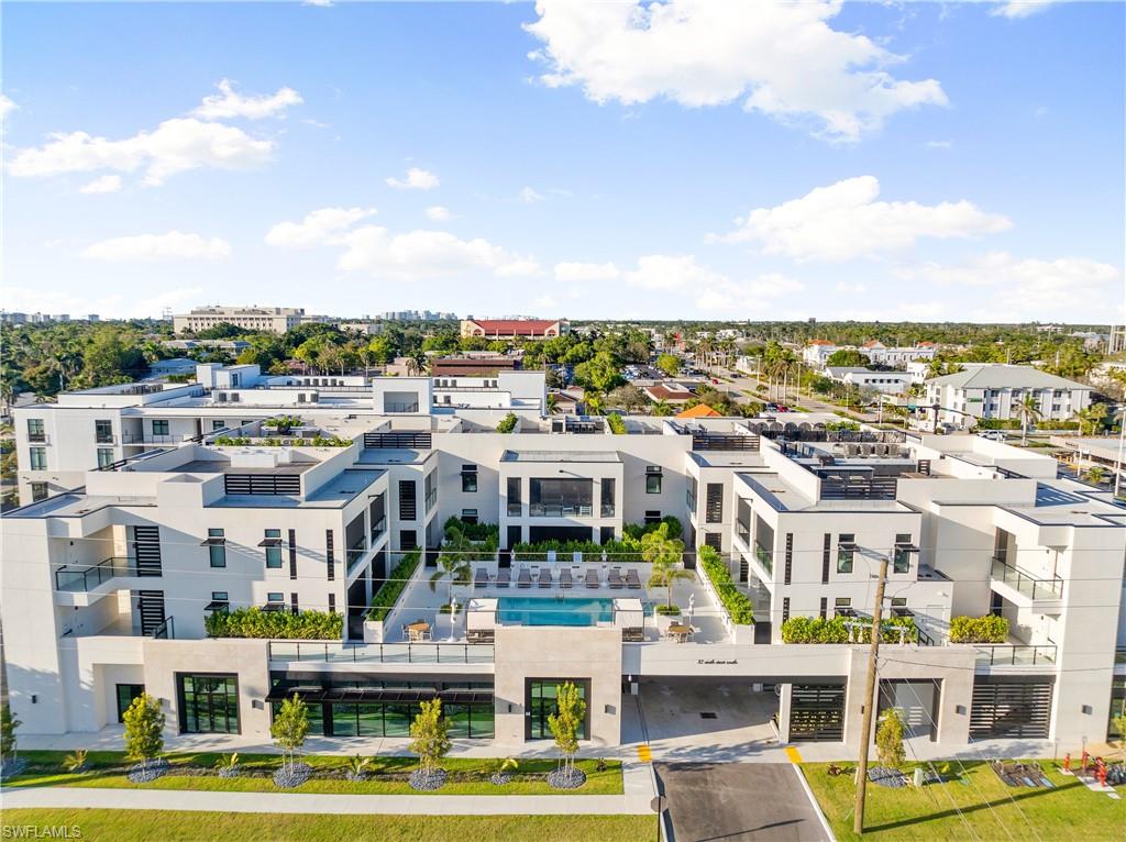 Priced under appraised value of $3.8 Million! Welcome to Stella Naples, where luxury meets exclusivity in the heart of Olde Naples. With only nine residences (each equipped with their own *PRIVATE ROOF DECK*), this newly constructed boutique building redefines upscale, low-density living, just steps from the world-renowned 5th Avenue South and our white sandy Naples beaches. Walking inside unit 304's solid wood front door you are immediately greeted with an open-concept floor plan featuring elevated ceilings, custom lighting throughout, plentiful storage, top of the line appliances (Miele, Viking, Sub-Zero), custom Ruffino cabinetry, natural gas, and a well equipped wet-bar featuring LED floating shelves, ice-maker, wine fridge, and a reverse osmosis system connected to the ice machine and drinking faucet. The split-bedroom floor plan offers privacy and comfort, boasting two spacious en-suite bedrooms with built-in closets, plus a den with custom built-ins and direct patio access. Outside, the covered patio is an inviting retreat, featuring custom wood-trim ceilings, an electronic privacy/bug screen, and a natural gas fireplace, perfect for relaxing year-round. Enjoy one of the most exclusive amenities in all of Olde Naples with your very own private roof-deck via direct access from your unit. This fully furnished outdoor oasis features a custom outdoor kitchen, Artesian natural gas grill, top-hat ice maker, and a fire pit, creating the ultimate setting for sunset cocktails before dining at one of the many iconic restaurants here in Downtown Naples. Residents of Stella Naples enjoy an exclusive collection of amenities, including a sunny Southern-exposure 24/7 heated pool, state-of-the-art fitness center with an outdoor turf area, and an elegant club room. The building also provides two deeded parking spaces, ample guest parking, and state-of-the-art security, featuring facial recognition technology and smartphone-integrated video access panels. Experience the finest in Downtown Naples luxury living at Stella Naples. Schedule your private tour today!