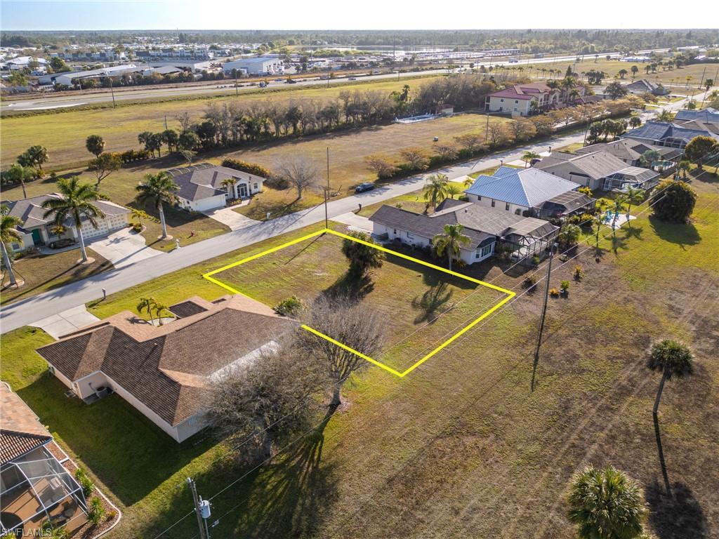 Build your dream home without the stress of flood insurance as this is in Flood Zone X. Burnt Store Meadows lot in this quiet and desired deed-restricted community with super low HOA fee annually of $290. This lot is not irregularly shaped so should accommodate most build options, as irregularly shaped lots tend to make the size of the home smaller to accommodate lot lines. This size lot would allow you to build a home over 2,000 sqft easily. 

With a greenbelt strip behind you, whether you're relocating from another part of Florida, or another state, this is a perfect lot to complete your relocation to southwest Florida. There are no owls, scrub jays or any other protected animal on this lot. City water and sewer are available. This lot is located within the Punta Gorda Isles Sec 18 subdivision, which is a sought after area of the growing beautiful city of Punta Gorda. You have quick access to Highway 41, Interstate-75, or Burnt Store Rd if you like to travel or explore around Florida. Whether your ideal region involves fishing, boating, golfing, biking, or just chilling with beautiful weather, look no further than this amazing lot. The seller is including a survey to make it easy for your builder to design your dream home.
