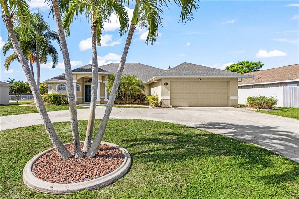 Thoughtfully designed and impeccably maintained, this custom-built residence showcases exceptional pride of ownership at every turn. Built by the owner, who was also the builder, every detail was carefully considered to create a home that is as functional as it is beautiful. Spotlessly clean and move-in ready, the home features soaring ceilings, modern finishes, and an open, inviting layout that is perfect for both everyday living and entertaining. Offering 3 spacious bedrooms plus a private office off the primary suite, you'll love waking up to peaceful views overlooking the pool. The luxurious primary retreat is a true sanctuary, featuring a spacious en-suite bathroom complete with dual vanities, a relaxing soaking tub, and a separate walk-in shower, creating the perfect space to unwind at the end of the day. The attached office provides an ideal setting for working from home, a private sitting room, or a personal fitness space, all while enjoying tranquil views of the pool. Every bedroom features its own walk-in closet, providing abundant storage throughout the home. The backyard is truly the heart of this property. Designed for year-round Florida living, the stunning pool and built-in spa create your own private oasis. Whether you're enjoying your morning coffee by the water, hosting weekend barbecues, relaxing in the spa after a long day, or entertaining friends under the Florida sunshine, the seamless indoor-outdoor living experience makes every day feel like a vacation. Multiple rooms throughout the home offer beautiful views of the sparkling pool, bringing natural light and resort-style ambiance indoors. Additional highlights include a spacious wrap-around driveway with ample parking, a new roof installed in 2022, a fenced yard added in 2023, and all assessments fully paid, providing tremendous value and peace of mind. Conveniently located near shopping, dining, schools, and everything Cape Coral has to offer, this home combines quality construction, thoughtful design, and an unbeatable location. Priced to sell quickly, this exceptional home is an incredible opportunity and is not expected to stay on the market for long. Schedule your private showing today before it's gone!