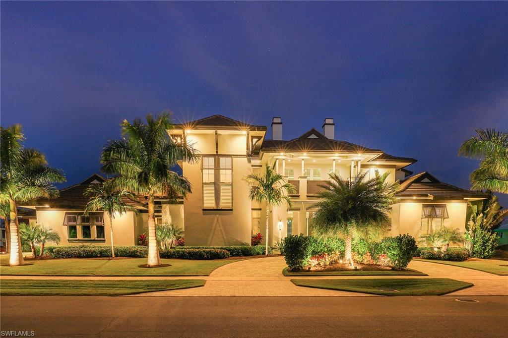 Better than new waterfront construction with long water views. This exceptionally well-built, all-concrete 5-bedroom, 5-1/2-bath home boasts super high-end finishes. It features wood-look tile throughout, exotic quartz countertops, shaker cabinetry, Thermador appliances, soaring ceilings, 10-foot tall pocketing sliders, custom closets and an elevator. A full home Sonos system and security system can all be controlled from the smart home iPad. There is a separate in-law suite on the main floor with a private entrance for longer quest stays with its own private lanai. Upstairs features 2 bedroom suites, a wet bar and a surround sound home theater loft area that is flanked by two balconies. The custom pool is long enough for laps and the completely private in-ground spa is perfect for relaxing after a long day on the boat or at the beach. A custom dock has been installed for up to a 38-foot boat with a 13+ foot beam on a 24k lift, 2 jet ski lifts, underwater lights and shore power. Quick Gulf access and proximity to Resident’s Beach access are sure to please boaters and beachgoers. The home is being sold fully furnished with all Restoration Hardware furniture throughout.