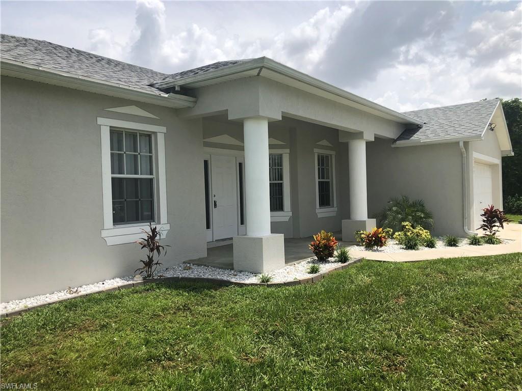 HUGE 4 bedroom family home with plenty of extra space.  Have you wanted the big house with a pool in the NE cape with quick access to Fort Myers and all the job centers.  This is your house.  This 2231 sq ft home boasts plenty of features and space not seen in most floor plans.  Plus this house has a brand new roof, a less than one year air conditioner with a 10 year parts and labor warranty and more.  As you enter this home you will see the entire house is tiled for easy maintenance.  To the left is a Den that could be enclosed for an additional bedroom.  To the right is a formal dining room right off the kitchen.  Forward you will see a large family room just off the kitchen and secondary bedrooms with quick access to the lanai through large sliding glass doors.  The kitchen has oak cabinets, a breakfast room, serving bar, walk in pantry and stainless steel appliances.  The master bedroom is large with lanai access and pool view.  Master bath has a spa tub & separate Shower  There is an oversized walk in closet along with a make up center at the sink.  The pool has brick pavers with a raised sun deck and waterfall overflow.  Just painted in and out with new roof and 1 year AC.