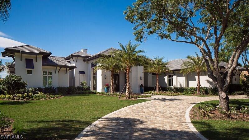 Built by Seagate Development, the Calusa's landscaped entry sequence will open to a wide foyer with a see through view of the great room and outdoor living area. The great room flows into a double island kitchen and  dining area with an indoor/outdoor bar that opens to a covered lanai space. A Gallery hallway will lead to a club room, two VIP guest suites and a garden courtyard. The club room will include a full bath and a walk-in closet and can serve as a fifth bedroom. A guest casita will be off an outdoor living area featuring an outdoor kitchen and bar, a fireplace, a custom pool and aspa, and a fire pit. The owner's wing will include a study with a sitting area, a master bedroom with a sitting area and private terrance, and a master bath with walk-in closets, his and her vanities, a freestanding tub and a walk-in shower. The home will have a coastal look inspired by a summer home in the Hamptons. The clean design will mix white walls and soft gray with classic blue and strong black accents. With an emphasis on natural materials and finishes, a mid-range wire brushed oak floor will run thought the home with various areas inset with stone.The plan also includes a four-car garage