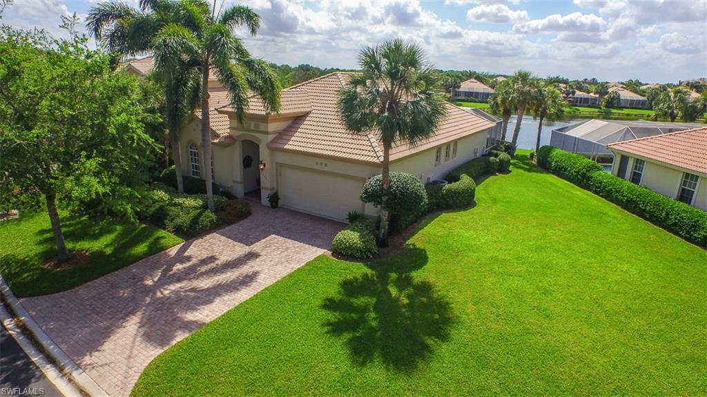 One of the most Stunning lakefront homes you will come across in Laurel Meadow! As you walk into this 3 bedroom + Den Heron, 2 bath, 2 car garage home, your breath will be taken away by the stunning professional décor that has been recently updated. Home was completely upgraded in 2010: Plantation shutters on all windows, vessel sink in guest bath, newer pool equipment, diagonally laid tile, whole home reverse osmosis, newer Trane A/C unit (Nov. 2012), cedar shelving in closets, interior paint, light fixtures, ceiling fans, and much more. Formal dining room has been converted into a den showcasing a built-in custom wall unit with a dry bar and beverage refrigerator. Gorgeous kitchen boasts granite counter tops, Bosch Stainless Steel appliances, custom back splash, and raised panel cabinets. Large master suite offering a California closet and en-suite featuring granite counter tops, custom cabinets with auto-close, Kohler toilet, custom frame-less shower, and newer lighting. Sip on a glass of wine on your expansive lanai and relish in the sought after south-eastern exposure while you take a dip in the pool with water feature or enjoy the views of the lake and water birds.
