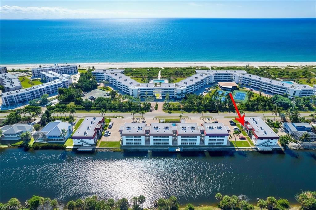 Step into island living at Spanish Cay! This ground-level 1BR/1BA condo has been completely rebuilt for   today’s standards in mind. Everything is new—electrical, plumbing, HVAC, lighting, appliances, tile flooring, walk-in shower, cabinetry, and impact sliders. The open kitchen features quartz counters, stainless steel appliances, and a breakfast bar that flows into the living area. A large glass-enclosed lanai extends the living space and is accessible from both the bedroom and living room. The complex is located along the Sanibel River and directly across from a beach access path.   Spanish Cay offers a peaceful setting with community pool, fishing piers, and easy access to bike trails. With only 40 units, it’s the perfect blend of privacy and convenience in the heart of Sanibel.